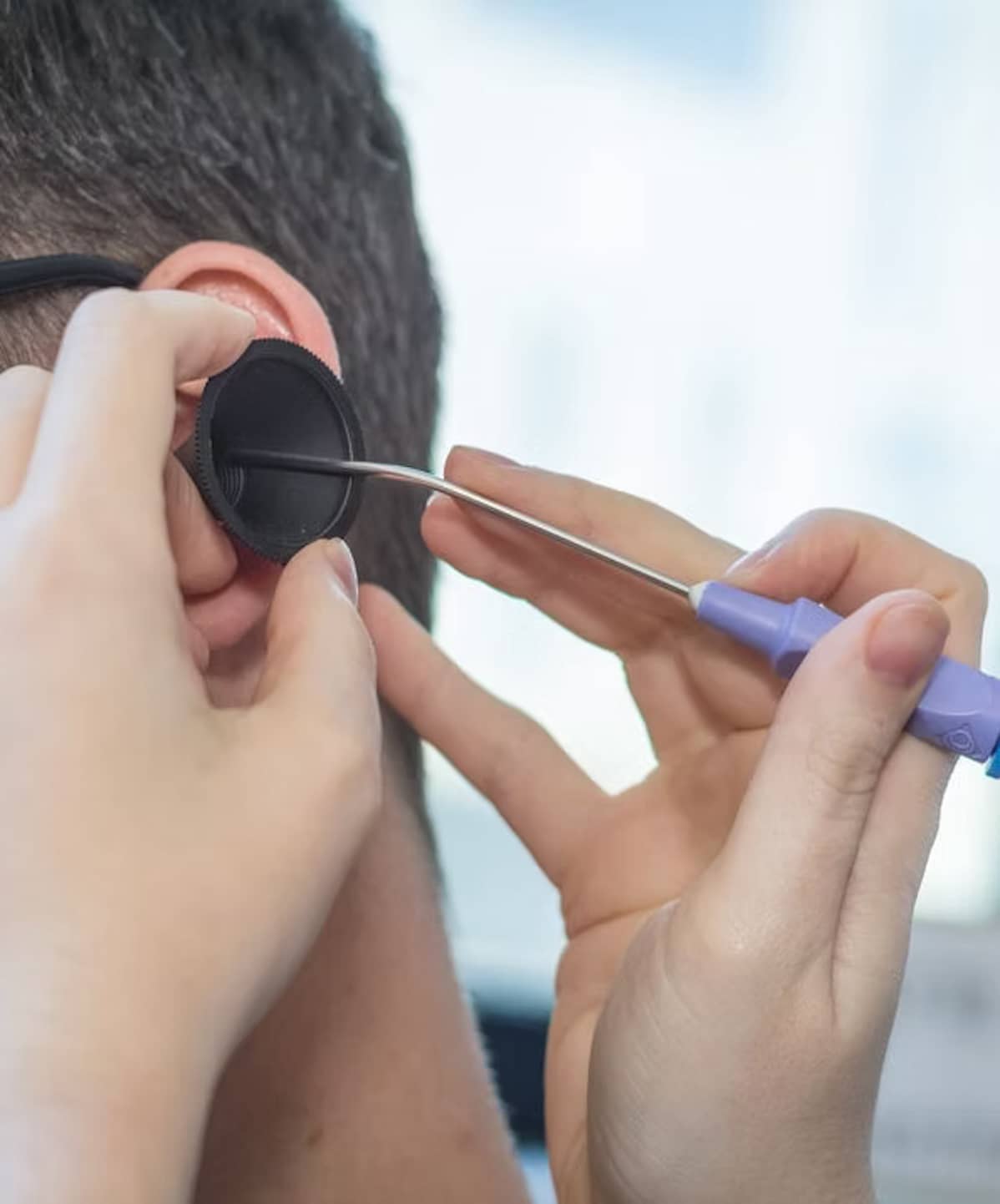 audiologist performing microsuction